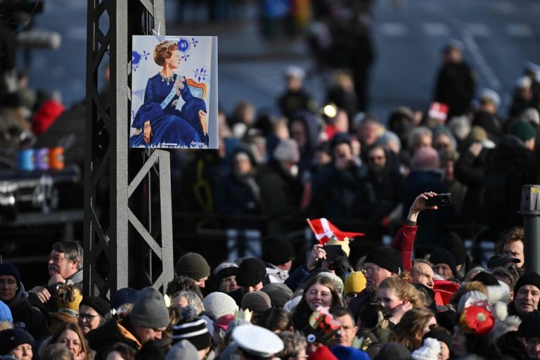 A poster of Queen Margrethe II of Denmark hangs on a tree prior to the start of the proclamation of her abdication at the Christiansborg Palace Square in Copenhagen, Denmark, on January 14, 2024. Denmark turns a page in its history on January 14 when Queen Margrethe abdicates and her son becomes King Frederik X, with more than 100,000 Danes expected to turn out for the unprecedented event. (Photo by Jonathan NACKSTRAND / AFP)