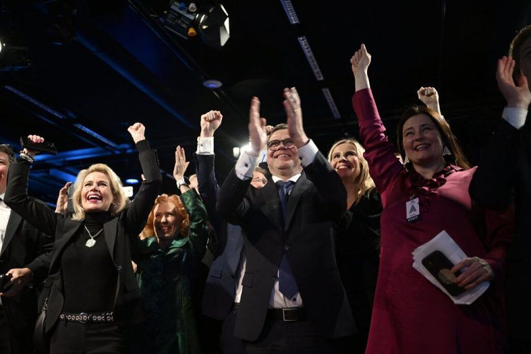 Finland's Prime Minister Petteri Orpo (C) reacts after the results of the Finnish presidential elections at the National Coalition Party (NCP) presidential candidate's election reception in Helsinki, Former conservative prime minister and favourite Alexander Stubb had an early lead over rival Pekka Haavisto in the Finnish presidential election's second round Sunday, from votes cast in advance. (Photo by Emmi Korhonen / Lehtikuva / AFP) / Finland OUT