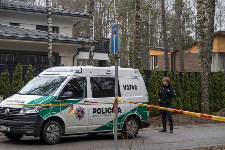 A police officer patrols near the house of Leonid Volkov, a close associate of the late Russian opposition leader Alexei Navalny, in Vilnius, Lithuania, Wednesday, March 13, 2024. Volkov on Wednesday blamed the government of Russian President Vladimir Putin after he was attacked with a hammer and tear gas outside his home near the Lithuanian capital, where he lives in exile, the late Navalny's anti-corruption foundation said. (AP Photo/Mindaugas Kulbis)