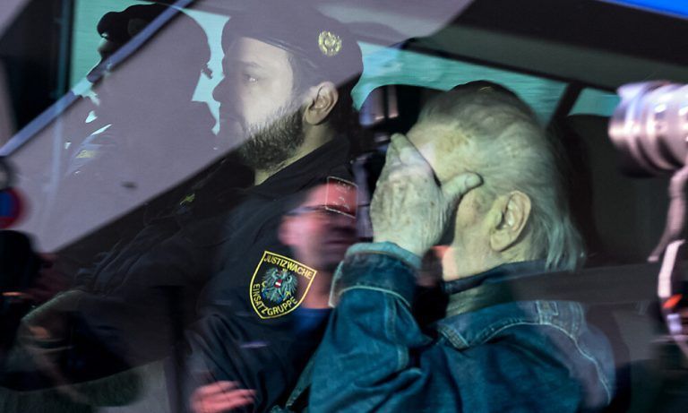 Austrian Josef Fritzl, who imprisoned his daughter in a cellar for over 24 years and fathered seven children with her, is escorted back to a prison after his hearing at the regional court in Krems an der Donau, Austria on January 25, 2024. The reginal court in Krems, some 80 kilometres (50 miles) northwest of Vienna, approved the application of Fritzl to be transferred out of the jail he is currently in for the mentally ill who pose a high degree of danger, to a regular prison. Fritzl, now 88, was sentenced to life in prison in 2009 for the murder by neglect of a new-born baby he fathered with his daughter Elisabeth while holding her in the purpose-built basement of his house. (Photo by Joe Klamar / AFP)