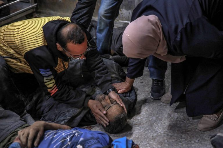 EDITORS NOTE: Graphic content / Palestinians identify a relative killed in Israeli bombardment in front of the morgue of the Al-Shifa hospital in Gaza City on March 15, 2024, amid the ongoing conflict between Israel and the Palestinian Hamas movement. (Photo by AFP)