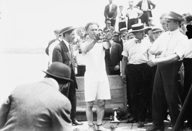 Harry Houdini being handcuffed before being nailed into a crate and lowered into New York Bay, 1912 b/w photo 1766225 Harry Houdini being handcuffed before being nailed into a crate and lowered into New York Bay, 1912 b/w photo Private Collection add.info.: Houdini, born Erik Weisz 1874-1926 in Budapest was nailed into a packing case said to contain iron weights, which he escaped through a trap.. Copyright: xBridgemanxImagesx 1766225