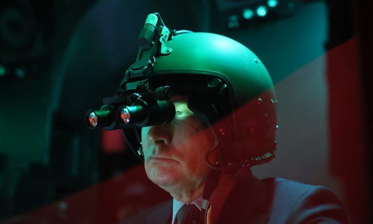 In this pool photograph distributed by the Russian state agency Sputnik, Russia's President Vladimir Putin visits the 344th Army Aviation Centre of aircrews combat training and transition in Torzhok in the Tver region on March 27, 2024. (Photo by Mikhail METZEL / POOL / AFP)