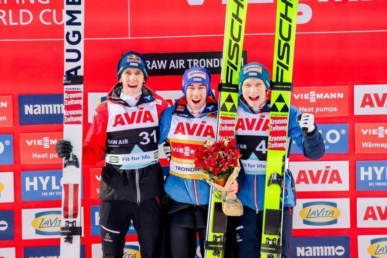 (L-R) Silver medal Austria's Daniel Tschofenig, gold medal Austria's Stefan Kraft and Austria's Jan Hoerl celebrate on the podium after winning the Men's Individual HS 138 event of the FIS world cup ski jumping competition in Trondheim, on March 13, 2024. (Photo by Geir Olsen / NTB / AFP) / Norway OUT