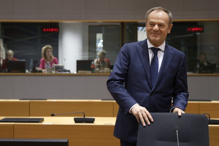 Poland's Prime Minister Donald Tusk takes his seat during a round table meeting at an EU Summit in Brussels, Friday, March 22, 2024. European Union leaders on Friday will discuss plans to boost investment and the economy. (AP Photo/Omar Havana)