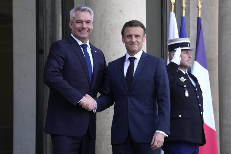 French President Emmanuel Macron, right, welcomes Austria's Chancellor Karl Nehammer before a meeting at the Elysee Palace in Paris, Thursday, April 4, 2024. (AP Photo/Thibault Camus)