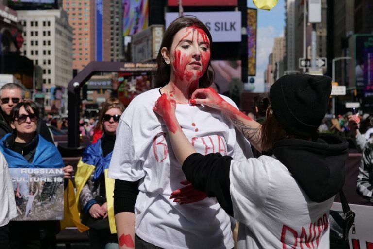 March 16, 2024, New York, New York, US: Guerilla Theater at an Anti Russia Pro Ukraine Rally in Times Square. Faux blood covered protesters decried Putin s Russian invasion of Ukraine demanding an end to the bloodshed. .With signage and shouts they asked for more U.S. military aid for the Ukranian people and an end to Russian propaganda. New York US - ZUMAh156 20240316_znp_h156_025 Copyright: xMiloxHessx