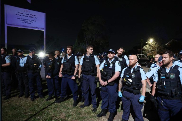 New South Wales police guard the perimeter of the Christ the Good Shepherd Church in Sydney's western suburb of Wakeley on April 15, 2024, after after several people were stabbed in the church premises. Australian police arrested a man after several people were stabbed at a church in Sydney on April 15 and emergency services said four people were being treated for non-life threatening injuries. (Photo by DAVID GRAY / AFP)