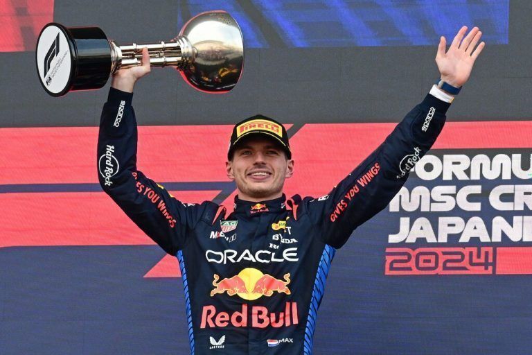 Red Bull Racing's Dutch driver Max Verstappen celebrates on the podium after the end of the Formula One Japanese Grand Prix race at the Suzuka circuit in Suzuka, Mie prefecture on April 7, 2024. (Photo by Yuichi YAMAZAKI / AFP)