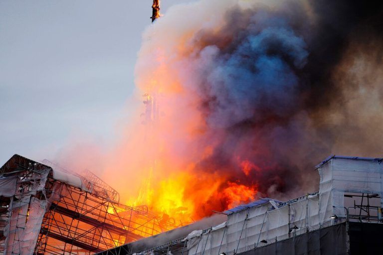 This photograph shows flames engulfing the Copenhagen's Stock Exchange building, in Copenhagen, on April 16, 2024. (Photo by Ida Marie Odgaard / Ritzau Scanpix / AFP) / Denmark OUT