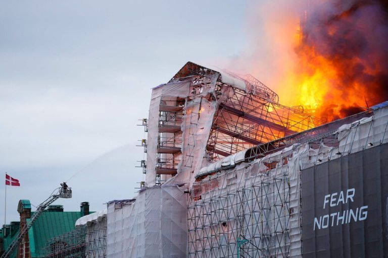This photograph shows flames engulfing the Copenhagen's Stock Exchange building, in Copenhagen, on April 16, 2024. (Photo by Ida Marie Odgaard / Ritzau Scanpix / AFP) / Denmark OUT