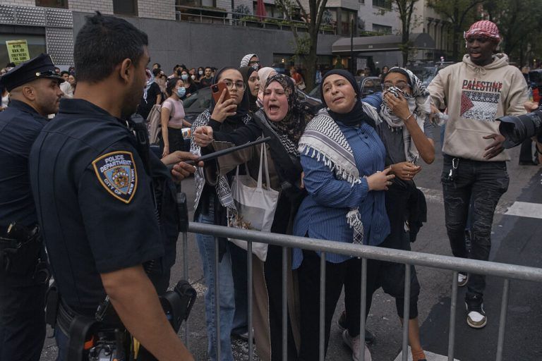 A police officer points at a pro-Palestinian protester with a baton near the Metropolitan Museum of Art where the Met Gala takes place, on Monday, May 6, 2024, in New York. (AP Photo/Andres Kudacki)