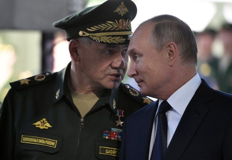 (FILES) In this pool photograph distributed by Russian state owned Sputnik agency Russian President Vladimir Putin (R) and Russian Defence Minister Sergei Shoigu visit the military Patriot Park in Kubinka, outside Moscow, on September 19, 2018. Russian President Vladimir Putin on May 12, 2024 moved to replace defence minister Sergei Shoigu in a major shake-up to Russia's military leadership more than two years into its Ukraine offensive. Putin proposed economist Andrey Belousov as Shoigu's replacement, according to a list of the ministerial nominations published by the Federation Council, Russia's upper house of parliament. (Photo by Alexey NIKOLSKY / POOL / AFP) / Editor's note : this image is distributed by Russian state owned agency Sputnik