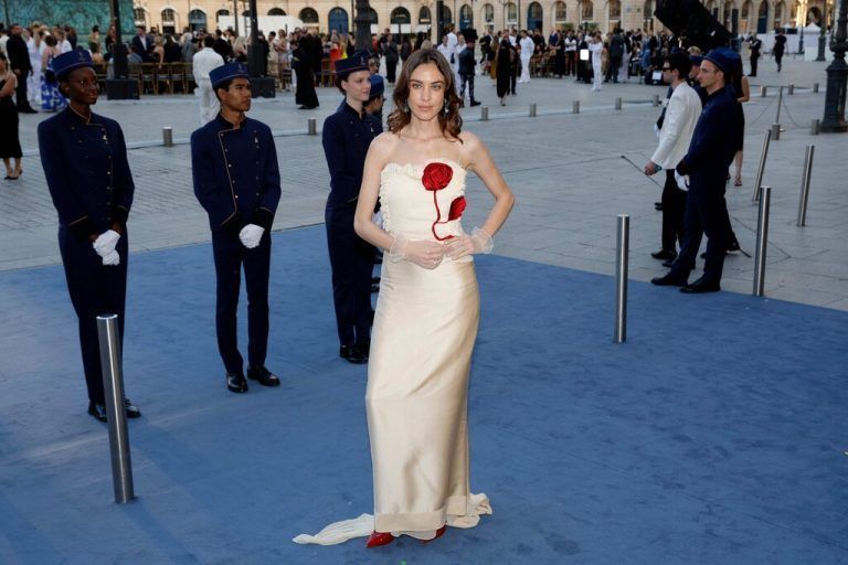British writer Alexa Chung poses during a photocall upon arrival to attend the Spring/Summer 2025 menswear ready to wear joint fashion show hosted by Vogue World as part of Paris Fashion Week at Place Vendome in Paris, on June 23, 2024, ahead of the upcoming Paris 2024 Olympic Games. (Photo by Geoffroy VAN DER HASSELT / AFP)