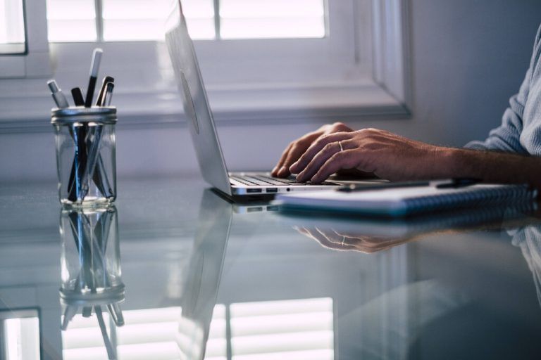 Businessman typing on laptop while working at home model released Symbolfoto property released SIPF02503