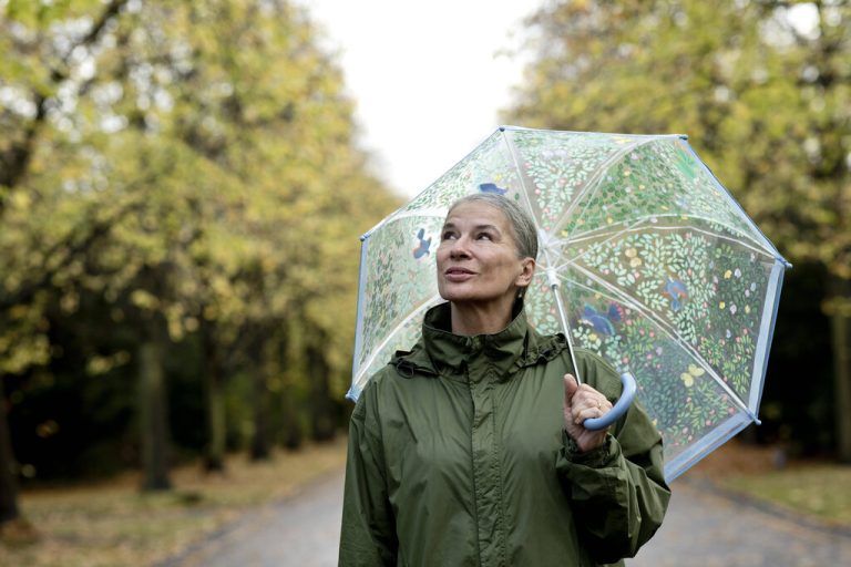Thoughtful senior woman holding umbrella model released, Symbolfoto, FLLF00806