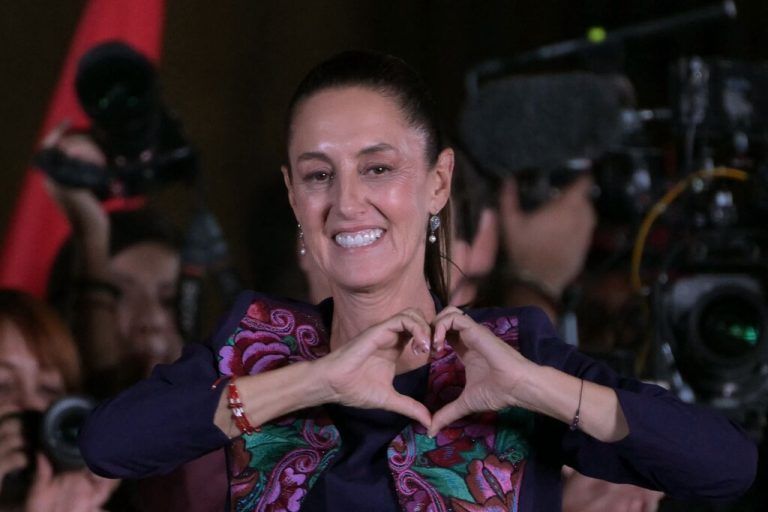TOPSHOT - Mexico's presidential candidate for Morena party Claudia Sheinbaum celebrates following the results of the general election at Zocalo Square in Mexico City, on June 3, 2024. Claudia Sheinbaum was set to be elected Mexico's first woman president, exit polls showed, a milestone in a country with a history of gender-based violence. (Photo by YURI CORTEZ / AFP)