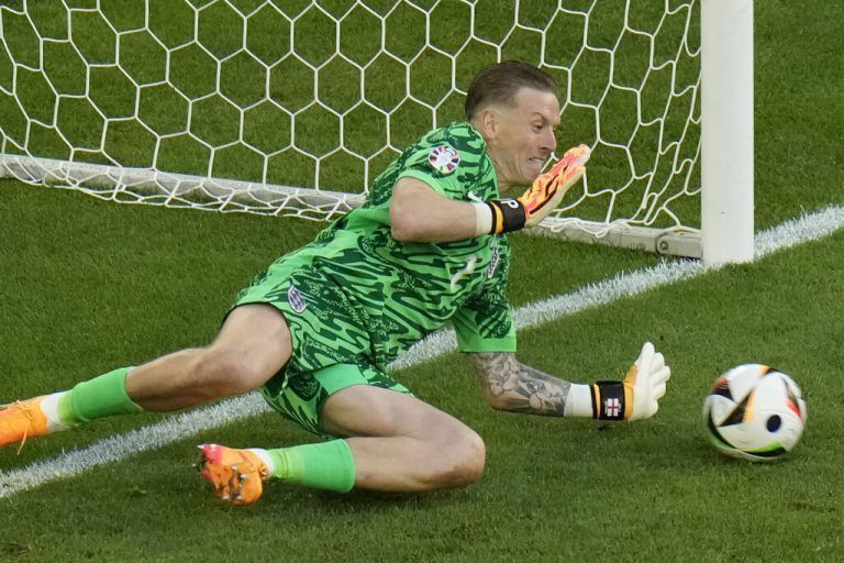 England's goalkeeper Jordan Pickford makes a save during a penalty shootout during a quarter final match between England and Switzerland at the Euro 2024 soccer tournament in Duesseldorf, Germany, Saturday, July 6, 2024. (AP Photo/Hassan Ammar)