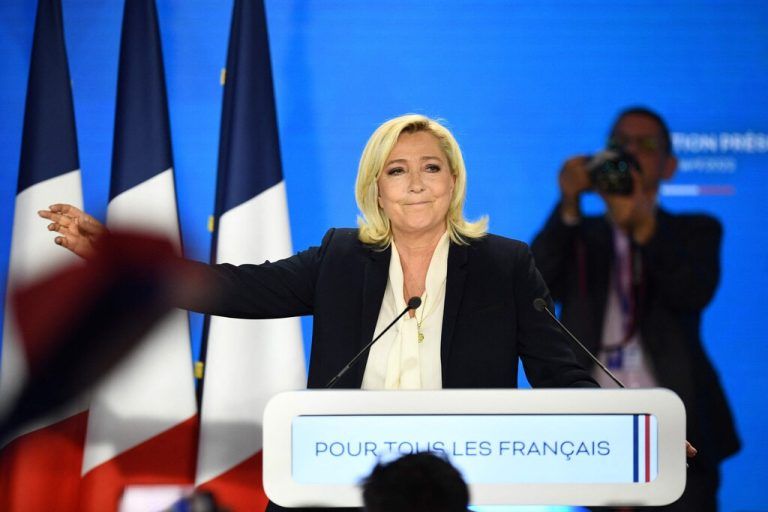 (FILES) French far-right party Rassemblement National (RN) presidential candidate Marine Le Pen reatcs after her speech at the Pavillon d'Armenonville in Paris on April 24, 2022 after the announcement of the first projections by polling firms of the French presidential election's second round results. The presidential campaign of Marine Le Pen (RN) in 2022 is the subject of an investigation into suspicions of illegal financing following a report from the National Commission for Campaign Accounts and Political Financing (CNCCFP), the Paris prosecutor's office said on Tuesday, confirming information from BFMTV. (Photo by Christophe ARCHAMBAULT / AFP)