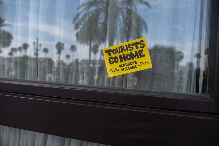 July 6, 2024, Barcelona, Catalonia, Spain: An anti-tourism sticker is seen glued to the glass of a hotel establishment. More than 3,000 people have demonstrated against the tourist overcrowding suffered by the city of Barcelona and in favor of tourism reduction policies. The demonstration has been symbolically closing hotel establishments, bars and restaurants while heading towards Barceloneta, one of the neighborhoods that suffers the most from the presence of tourism. Barcelona Spain - ZUMAs197 20240706_aaa_s197_268 Copyright: xPacoxFreirex