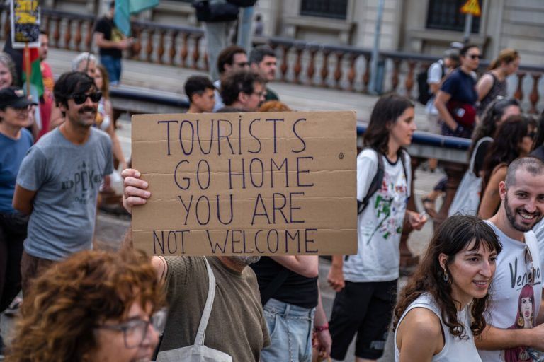 July 6, 2024, Barcelona, Catalonia, Spain: An anti-tourism placard is seen during the demonstration. More than 3,000 people have demonstrated against the tourist overcrowding suffered by the city of Barcelona and in favor of tourism reduction policies. The demonstration has been symbolically closing hotel establishments, bars and restaurants while heading towards Barceloneta, one of the neighborhoods that suffers the most from the presence of tourism. Barcelona Spain - ZUMAs197 20240706_aaa_s197_259 Copyright: xPacoxFreirex
