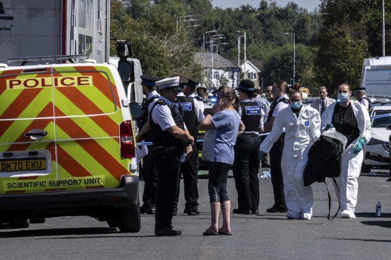 Police work at the scene in Southport, England, where a man has been detained and a knife has been seized after a number of people were injured in a reported stabbing, Monday July 29, 2024. (James Speakman/PA via AP)