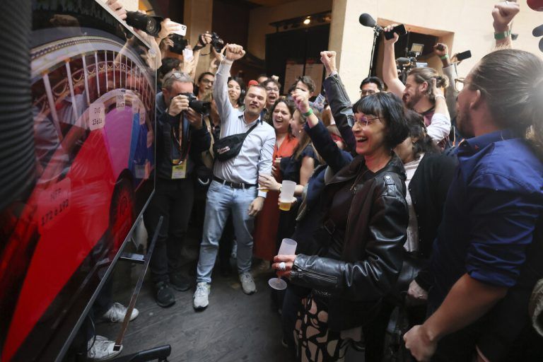 Supporters of the far-left La France Insoumise - LFI - (France Unbowed) parry react at the party election night headquarters, Sunday, July 7, 2024 in Paris. A coalition on the left that came together unexpectedly ahead of France's snap elections won the most parliamentary seats in the vote, according to polling projections Sunday. The surprise projections put President Emmanuel Macron's centrist alliance in second and the far right in third. At left is LFI's Mathilde Pant and at center Manuel Bompard. (AP Photo/Thomas Padilla)