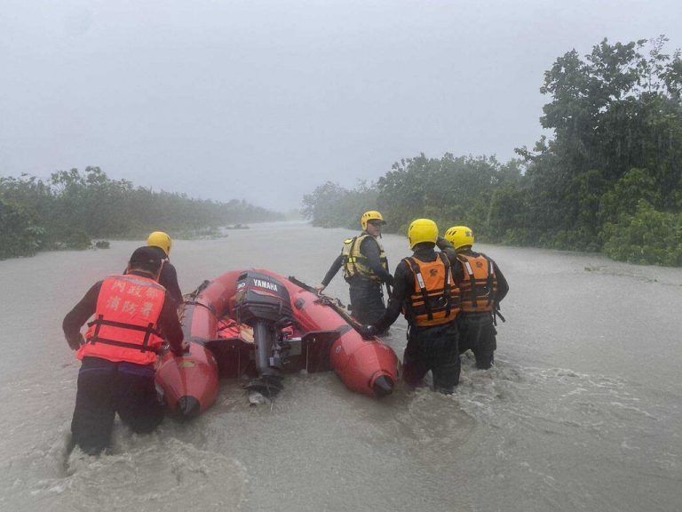 This photo released by Pingtung Fire Department shows, firefighters on their way to evacuate local residents  during floods after Typhoon Gaemi made landfall in Pintung county, Taiwan, Thursday, July 25, 2024. (Pingtung Fire Department via AP)