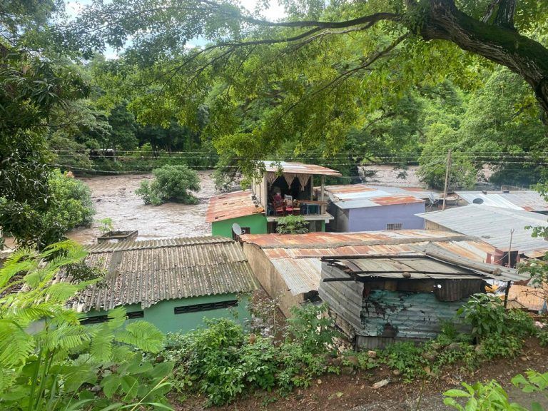 View of flooded houses after a river swelled due to heavy rains following the passage of Hurricane Beryl on the road from Cumana to Cumanacoa, Sucre State, Venezuela, on July 2, 2024. Hurricane Beryl churned towards Jamaica Tuesday after killing at least five people and causing widespread destruction across the southeastern Caribbean, threatening deadly winds and storm surge as it approached. (Photo by Victor GONZALEZ / AFP)
