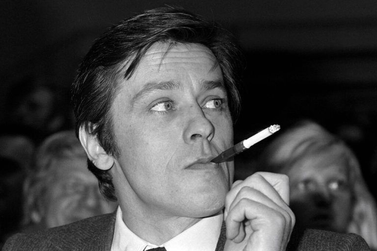 (FILES) A portrait taken on March 5, 1976 shows French actor Alain Delon smoking. French film legend Alain Delon has died at the age of 88, his three children told AFP in a statement on August 18, 2024, following a battle with ill health. (Photo by AFP)