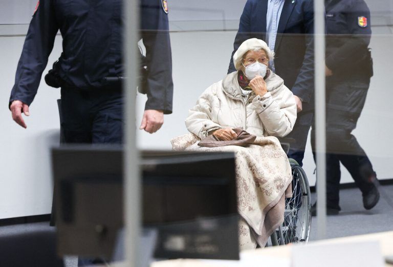 (FILES) Defendant Irmgard F, a former secretary for the SS commander of the Stutthof concentration camp, is brought to a courtroom in Itzehoe, northern Germany, where her verdict was spoken on December 20, 2022. Germany's Federal Court of Justice on August 20, 2024 approved the verdict against Irmgard F, a now 99-year-old former Nazi concentration camp secretary who had appealed against her conviction for complicity in murder. The Itzehoe court had handed a two-year suspended sentence to Irmgard F over complicity in the murder of more than 10,000 prisoners at the Stutthof camp in then occupied Poland. (Photo by Christian Charisius / POOL / AFP)