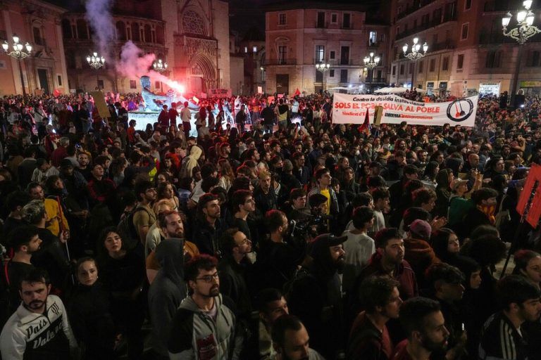 Demonstrators gather in a square during a demonstration to demand the resignation of Valencia Regional President Carlos Mazon in Valencia on November 9, 2024. The European nation's worst floods in a generation have killed at least 220 people, left dozens missing and submerged entire towns in mud, particularly in the eastern Valencia region. (Photo by Cesar Manso / AFP)
