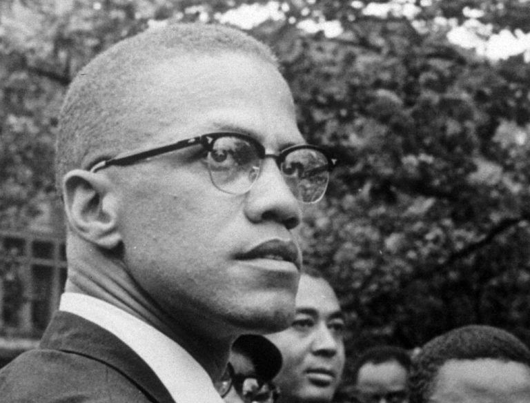 FILE - In this 1963 file photo, Malcolm X attends a rally at Lennox Avenue and 115th Street in the Harlem neighborhood of New York. The Nebraska Legislature on Thursday, March 28, 2024 passed a bill to recognize the civil rights icon every May 19, the day Malcolm X was born Malcolm Little in Omaha, Nebraska, in 1925. The amendment recognizes May 19 as El-Hajj Malik El-Shabazz, Malcolm X Day, to allow Nebraska schools to hold exercises to recognize the civil rights leader. (AP Photo/Robert Haggins, File)
