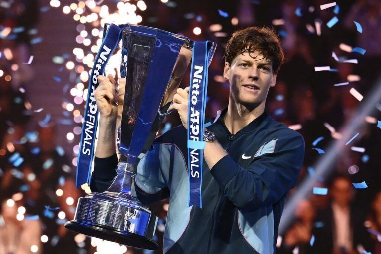 Italy's Jannik Sinner lifts the trophy after winning the final against USA's Taylor Fritz at the ATP Finals tennis tournament in Turin on November 17, 2024. (Photo by Marco BERTORELLO / AFP)
