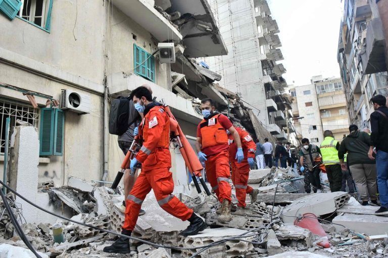 Rescuers rush to the site of an Israeli strike that targeted Beirut’s Ras al-Nabaa neighbourhood on November 17, 2024, where a Lebanese security source said a Hezbollah official was killed. (Photo by Fadel ITANI / AFP)